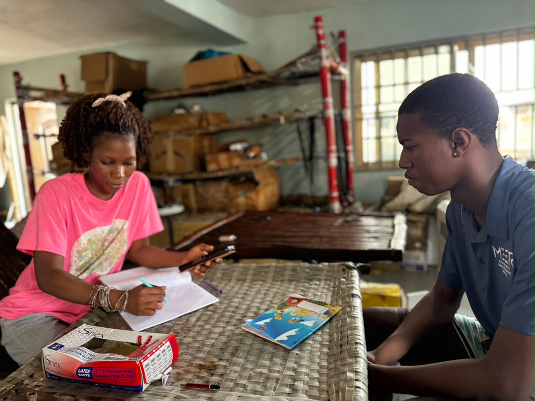 A MEER team member conducting a thermal comfort survey interview with a community member