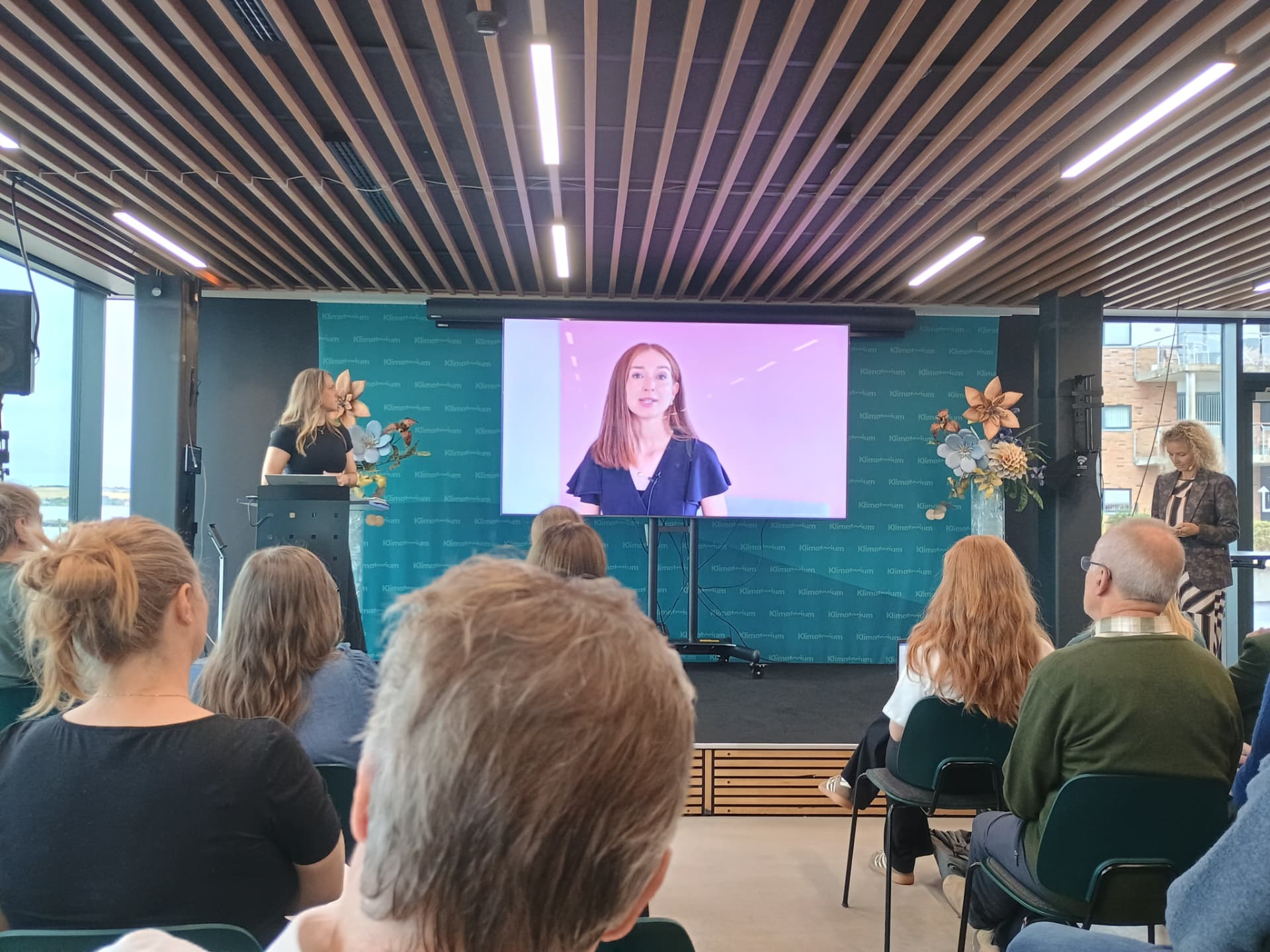 A speaker addresses delegates at Denmark's National Climate Summit 2026 at the Klimatorium in Lemvig