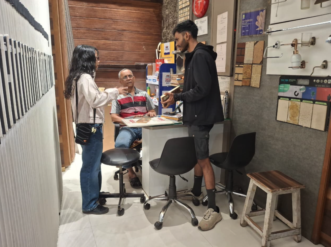 MEER India team members discussing material samples with a supplier
